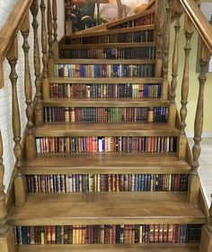 an old wooden staircase with books on it