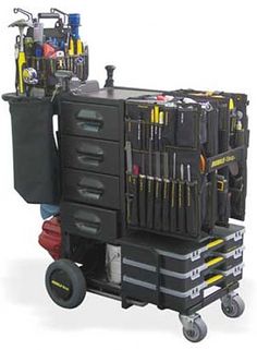 the tool cart is loaded with tools and other items on it's back wheels