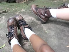 two people wearing brown shoes and white socks