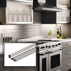 an image of a kitchen setting with stainless steel appliances and white subway tile backsplash