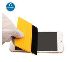 a person holding an iphone with a yellow case on it's back and the screen partially covered in white gloves