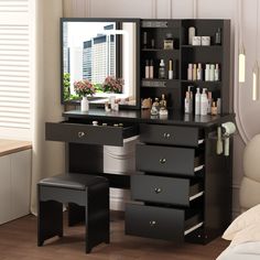 a black vanity with drawers and stools in front of a mirror on the wall