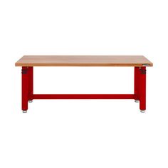 a wooden table with red metal legs