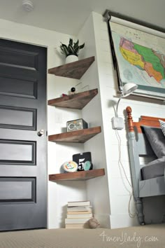 a bed room with a neatly made bed and shelves