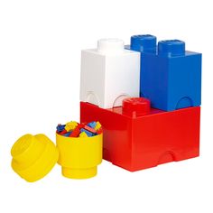 three legos are stacked on top of each other and one has a yellow cup