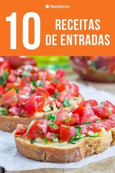 bread topped with tomatoes and cheese on top of a wooden cutting board next to an orange sign