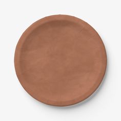 a brown paper plate on a white background