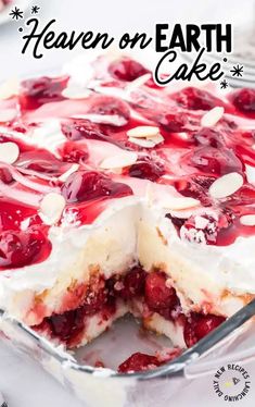 a cake with cherries and almonds on top in a pan, ready to be eaten