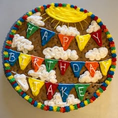 a birthday cake is decorated with colorful decorations