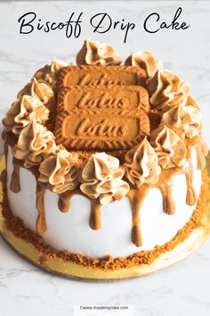 a close up of a cake on a plate with the words biscuit drip cake