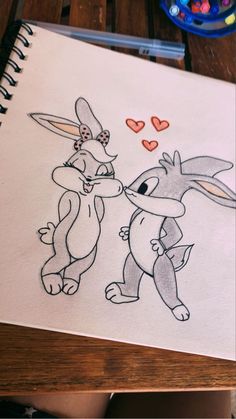 a drawing of two rabbits with hearts in the background