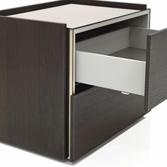 an open drawer on the side of a cabinet with its door open and drawers closed