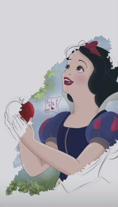 snow holding an apple in her hands