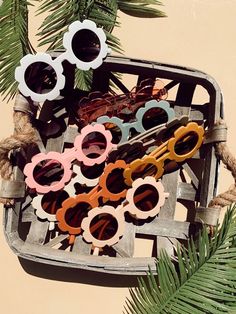 several pairs of sunglasses are sitting in a basket