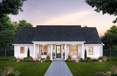 a small white house with lots of windows on the front and side of it, surrounded by greenery