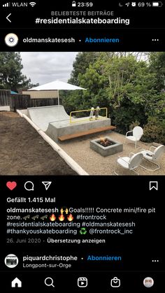 an outdoor fire pit in the middle of a yard