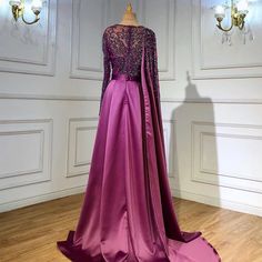 Gorgeous Grape Hue: A rich grape purple color that exudes sophistication and allure, making it an ideal choice for evening events and parties in 2024 . Elegant Silhouette: The dress boasts an elegant silhouette that drapes beautifully, enhancing your natural grace and charm. High Split: A high split in the skirt adds a touch of sensuality and allows for ease of movement, perfect for dancing and making a grand entrance. Luxurious Satin Fabric: The gown is crafted from luxurious satin fabric, addi Luxury Purple Gown, Luxury Purple Formal Gown, Elegant Purple Evening Dress, Elegant Purple Dress For Evening, Formal Purple Satin Evening Dress, Luxury Purple Evening Dress For Wedding, Luxury Purple Wedding Evening Dress, Luxury Purple Floor-length Gown, Elegant Purple Prom Gown