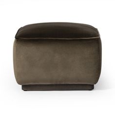 the foot stool is made from dark brown fabric