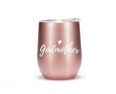 a pink wine tumbler with the words godmother written in white on it