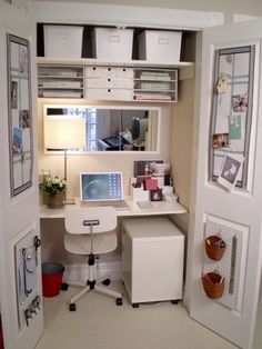 a home office with white furniture and lots of storage