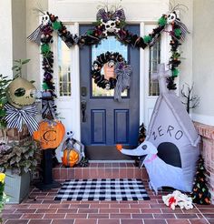 a front door decorated for halloween with decorations