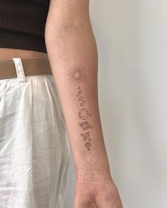 a person with a small tattoo on their arm