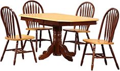 a wooden table and four chairs with one chair up against the other, in front of a white background