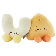 two stuffed animals sitting next to each other on a white surface with a knife in their hand