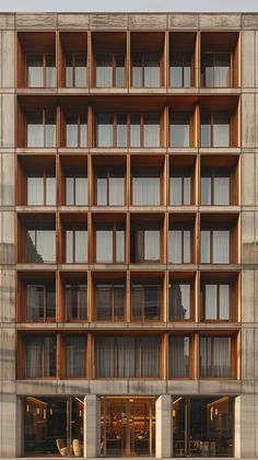 an apartment building with many windows and balconies