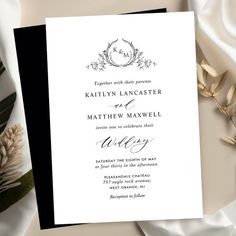 an elegant black and white wedding card