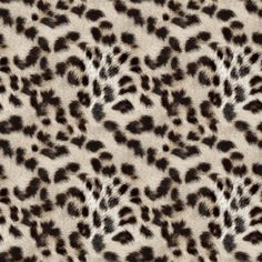 an animal print pattern with brown and white spots on it's fur, which is very