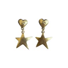 Earrings for a STAR! The Billie earrings sport hand-carved 12k antiqued gold plated pewter heart studs with stainless steel posts and have mini 12k antiqued gold plated pewter star charms adorning them. They'll have you shimmering all night long! Avoid contact with water, perfumes, and lotions. Romcom Outfits, Chunky Earrings, August Birthstone Jewelry, July Birthstone Jewelry, Jewelry Ring Box, Pearl Jewellery Earrings, Evil Eye Jewelry, Earring Sale, Heart Studs