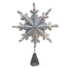 a metal snowflake with lights hanging from it's sides on a white background