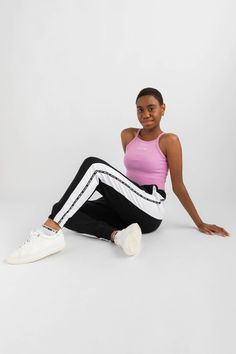 An essential style for everyday wear. Designed in a high neckline, racer style shape that is cropped in length. Features a soft finish folded hemband that is ultra-comfortable to wear. Ideal to layer over crop tops. Athleisure Cropped Sports Bottoms, Cropped Athleisure Bottoms For Sports, Casual Crop Top Sports Bra, Trendy Cropped Activewear For Spring, Cropped Elastane Sports Bra, Spring Sportswear Stretch Crop Top, Spring Stretch Sportswear Crop Top, Trendy Sports Crop Top, Trendy Crop Top Activewear For Spring