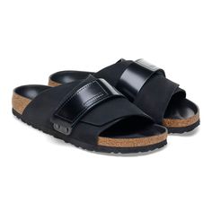 Kyoto Nubuk Leather Black Leather Double Strap Footbed Sandals, Black Double Strap Footbed Sandals With Leather Sole, Black Leather Double Strap Slides, Black Leather Slide Footbed Sandals, Modern Leather Slides With Buckle Closure, Modern Black Slides With Buckle Closure, Modern Leather Double Strap Slides, Modern Double Strap Leather Slides, Modern Leather Slides With Double Strap