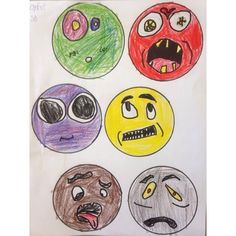 four different colored faces drawn on paper with one being angry and the other is frowning