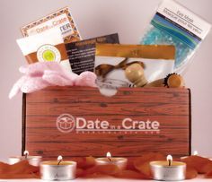 a wooden box filled with candles and items