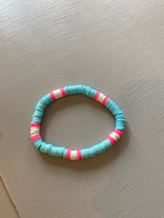 a beaded bracelet sitting on top of a table