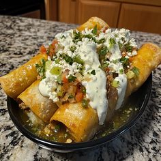 a plate filled with mexican food on top of a counter