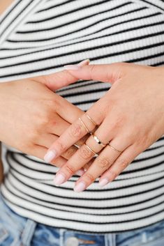 If you're all about making a statement, then you have just met your match— because the Stella Gold Ring Set is ready to catch everyone's eye! This set of five dainty gold rings feature varying shapes and textures. Wear the Stella Rings separately or stack them all together, either way you'll love them! Gold Plated Set of 5 Ring Sizes Vary 5.5 - 7.5 Plain Ring Design, Simple Gold Band, Plain Ring, Plain Rings, Gold Rings Simple, Dainty Gold Rings, Single Ring, Sterling Silver Rings Bands, Gold Ring Sets