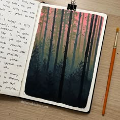 an open notebook with trees and writing on it