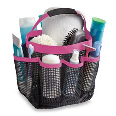 a black and pink mesh bag filled with personal care items on top of a white background