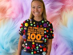 a woman wearing a t - shirt that says i'm feeling fabulous and fuzzy because it's her 100 days of school