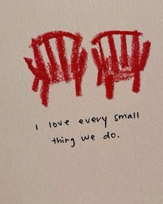 the words love every small thing we do written in red ink on a piece of paper