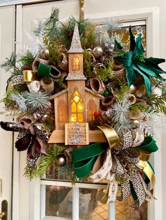 a christmas wreath with a church on it