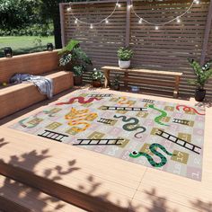 an outdoor area with wooden steps and plants on the ground, including a large rug