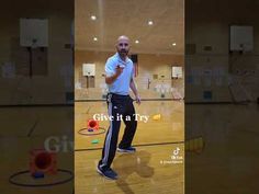 a man standing on top of a basketball court