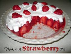 a strawberry pie with whipped cream and strawberries on top is ready to be eaten