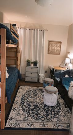 a bedroom with bunk beds and rugs on the floor