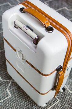 Delsey Hardside Chatlet Suitcase–The best carry-on you'll ever buy! Cheap Suitcases, White Suitcase, Luggage Ideas, Carry On Suitcase, Suitcase Traveling, Golden Girl